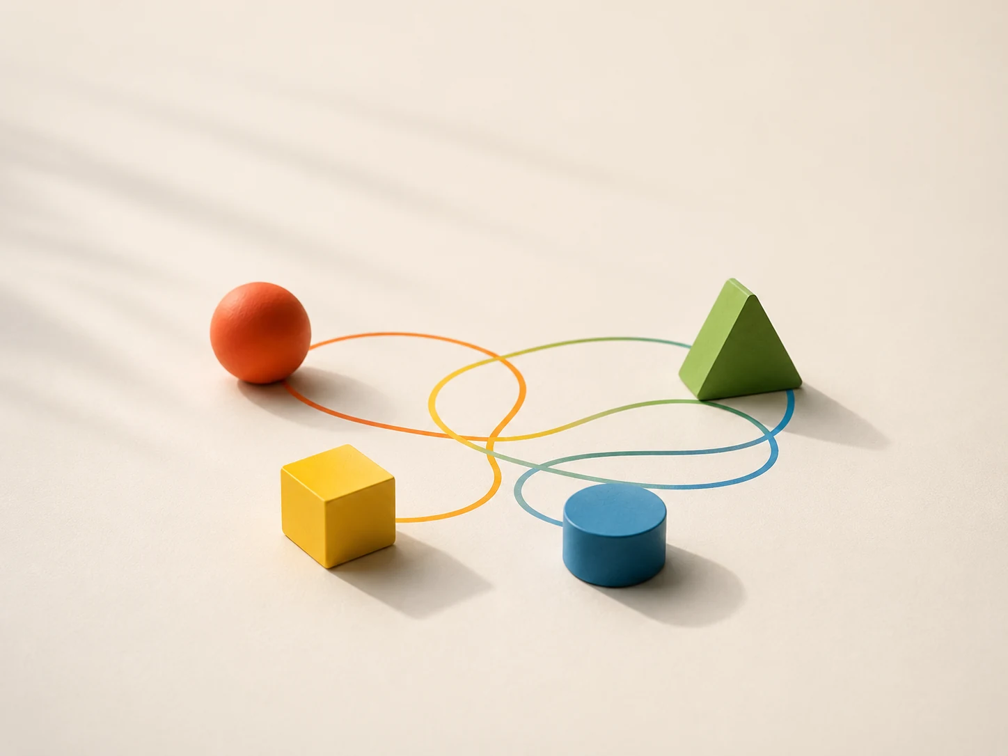 Colourful geometric forms connected by looping paths in a relational system