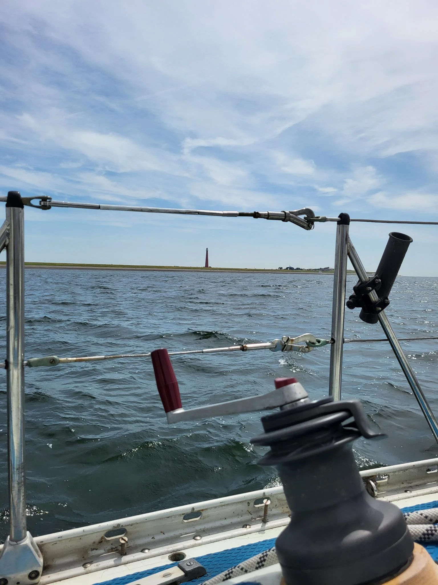 Sailing winch on deck with open water during a Sail4Recovery weekend